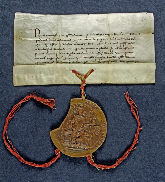 Reprodukce rubové strany listiny, kterou Václav III. daroval Unkovi z Majetína královský les Chrudim. Později zde byla založena vesnice Grygov. Foto: SOkA Olomouc, Archiv města Olomouc, Listiny, inv. č. 5, 1306, 9. 1., Praha